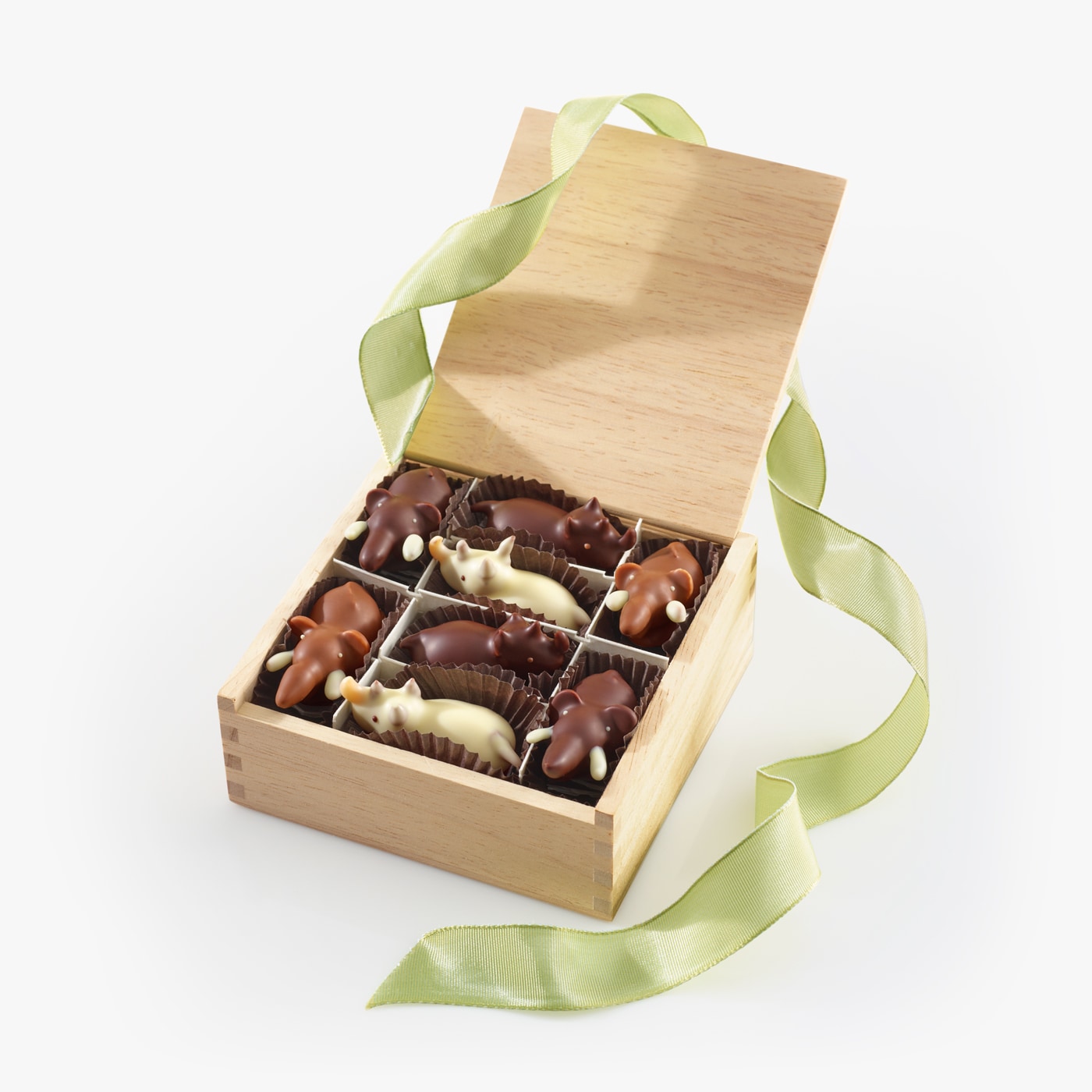 Four of our Chocolate Elephants and four of our new Chocolate Rhinos nestled inside our signature wooden gift box.
